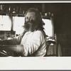 The Hermit of Maine playing his unique instrument, combination of two organs and a piano. Freeport, Maine.
