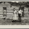 Mrs. Cornelius and son standing by their log house, homesteaded in 1912. They will be resettled. Beltrami Island reforestation project, Minnesota.