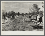 Street lined with partially-completed homes. Newport News Homesteads, Virginia.