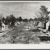 Street lined with partially-completed homes. Newport News Homesteads, Virginia.