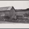 Cows going into the barn early in the morning on the farm of William Gaynor, FSA (Farm Security Administration) dairy farmer, Fairfield, Vermont.