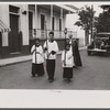 A funeral procession along the main street in Yauco, Puerto Rico.