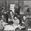 Lunch hour at one of the farms of the Woodman Potato Company. All of the pickers and field laborers eat in this converted tool house, eleven miles north of Caribou, Maine.