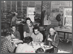 Lunch hour at one of the farms of the Woodman Potato Company. All of the pickers and field laborers eat in this converted tool house, eleven miles north of Caribou, Maine.