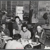 Lunch hour at one of the farms of the Woodman Potato Company. All of the pickers and field laborers eat in this converted tool house, eleven miles north of Caribou, Maine.