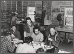 Lunch hour at one of the farms of the Woodman Potato Company. All of the pickers and field laborers eat in this converted tool house, eleven miles north of Caribou, Maine.
