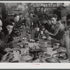 Lunch hour at one of the farms of the Woodman Potato Company. All of the pickers and field laborers eat in this converted tool house, eleven miles north of Caribou, Maine.
