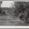 Dangerous hidden farm road leading on to main highway. On a farm near Devon, Connecticut.