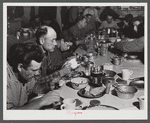 Lunch hour at one of the farms of the Woodman Potato Company. All of the pickers and field laborers eat in this converted toolhouse. Eleven miles north of Caribou, Maine.