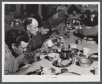 Lunch hour at one of the farms of the Woodman Potato Company. All of the pickers and field laborers eat in this converted toolhouse. Eleven miles north of Caribou, Maine.