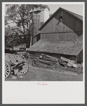 Old boards and rusty nails piled up where they might be dangerous. Farm of Mr. Theodore German. North Branford, Connecticut.