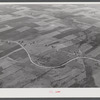 Potato farms in Aroostook County showing the layout of land. The highway curving in the foreground is U.S. 1.