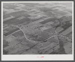 Potato farms in Aroostook County showing the layout of land. The highway curving in the foreground is U.S. 1.