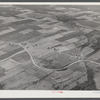 Potato farms in Aroostook County showing the layout of land. The highway curving in the foreground is U.S. 1.