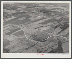 Potato farms in Aroostook County showing the layout of land. The highway curving in the foreground is U.S. 1.