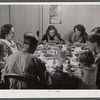Dinner hour at the home of Mr. J.H. Dube, French-Canadian potato farmer, after he and the boys had finished a day's work in their potato field in Wallagrass, Maine.