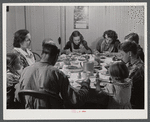 Dinner hour at the home of Mr. J.H. Dube, French-Canadian potato farmer, after he and the boys had finished a day's work in their potato field in Wallagrass, Maine.