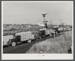 Trucks outside a starch factory in Caribou, Maine. Some of them have been waiting in line for over twenty-four hours for their turn to have their potatoes weighed and graded.