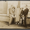 Harry Houdini, Bess Houdini, Ching Ling Foo, Chee Toy, and Tobias Bamberg (aka Okito) outside the Brighton Beach Music Hall, with promotional posters for Foo displayed behind
