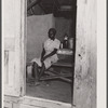 Migratory agricultural worker in her shack where she lives with eleven others. Belcross, North Carolina.