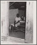 Migratory agricultural worker in her shack where she lives with eleven others. Belcross, North Carolina.