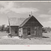 Thirty-five migrants use this farmhouse as their home. Near Old Trap, North Carolina.