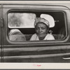 Migratory agricultural worker with seven others in the car on their way to Cranberry, New Jersey, for the potato season.