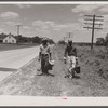 Migratory agricultural workers on Route 27 trying to "hitch" north with the potato season. North Carolina.