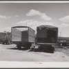 Empty trucks waiting at Elizabeth City, North Carolina, freight station to be loaded with potatoes for the northern cities.