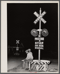 Migratory agricultural workers having supper at the railroad crossing at Camden, North Carolina.