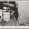 Cooking facilities for migratory agricultural workers living in the attic of a potato grading station at Belcross, North Carolina.
