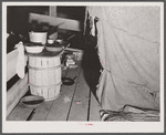 Cooking facilities for migratory agricultural workers living in the attic of a potato grading station at Belcross, North Carolina.