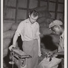 Weighing potatoes at the grading station at Belcross, North Carolina.