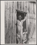 Father and two of his children at a migrants' camp at Staytonville, Delaware.