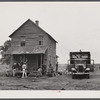 Florida migrant making preparations to leave a house at Belcross, North Carolina, for another job at Onley, Virginia.