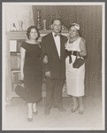 Graciela Garcia, Juan Rosario, and Melba Alvarado by bookcase