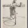 Graciela Garcia, with bicycle, on Edgecombe Avenue, 1945