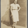 Graciela Garcia stands with hand on hip and bow in her hair
