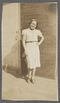 Graciela Garcia stands with hand on hip and bow in her hair