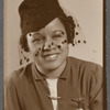 Graciela Garcia in hat with veil in studio portrait