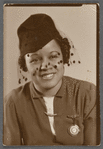 Graciela Garcia in hat with veil in studio portrait