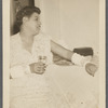 Graciela Garcia sitting at table with drink
