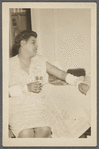 Graciela Garcia sitting at table with drink