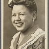 Graciela Garcia with flowers in hair in studio portrait
