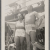 Teresa and Eduardo Roldan in sunglasses at the beach, c. 1940s