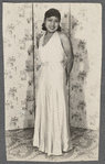 Teresa Roldan stands in long sleeveless dress