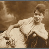 Young woman reclining in formal portrait