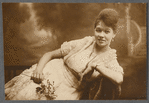 Young woman reclining in formal portrait