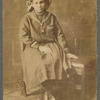 Girl in sailor-type dress in formal portrait
