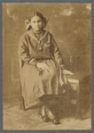 Girl in sailor-type dress in formal portrait